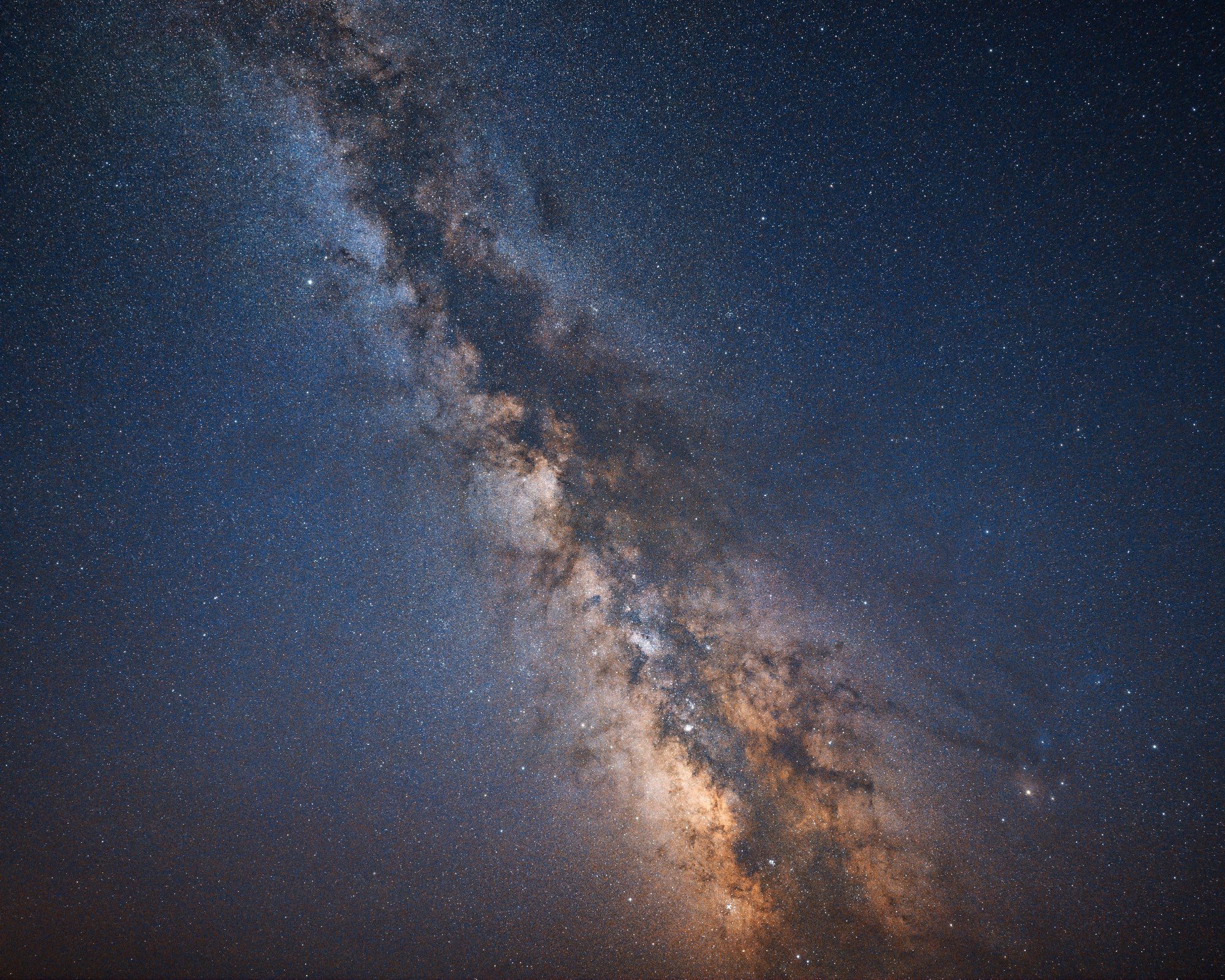 Milky Way galaxy as seen from space with stars and cosmic dust.